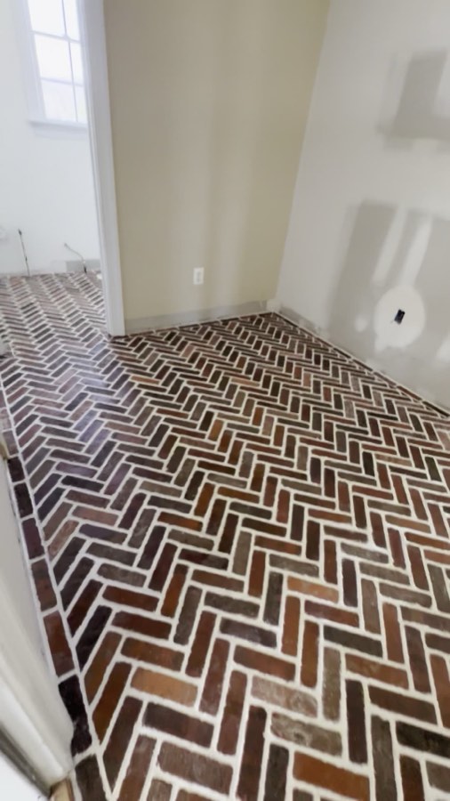 Herringbone brick paver floor, hand-laid and grouted